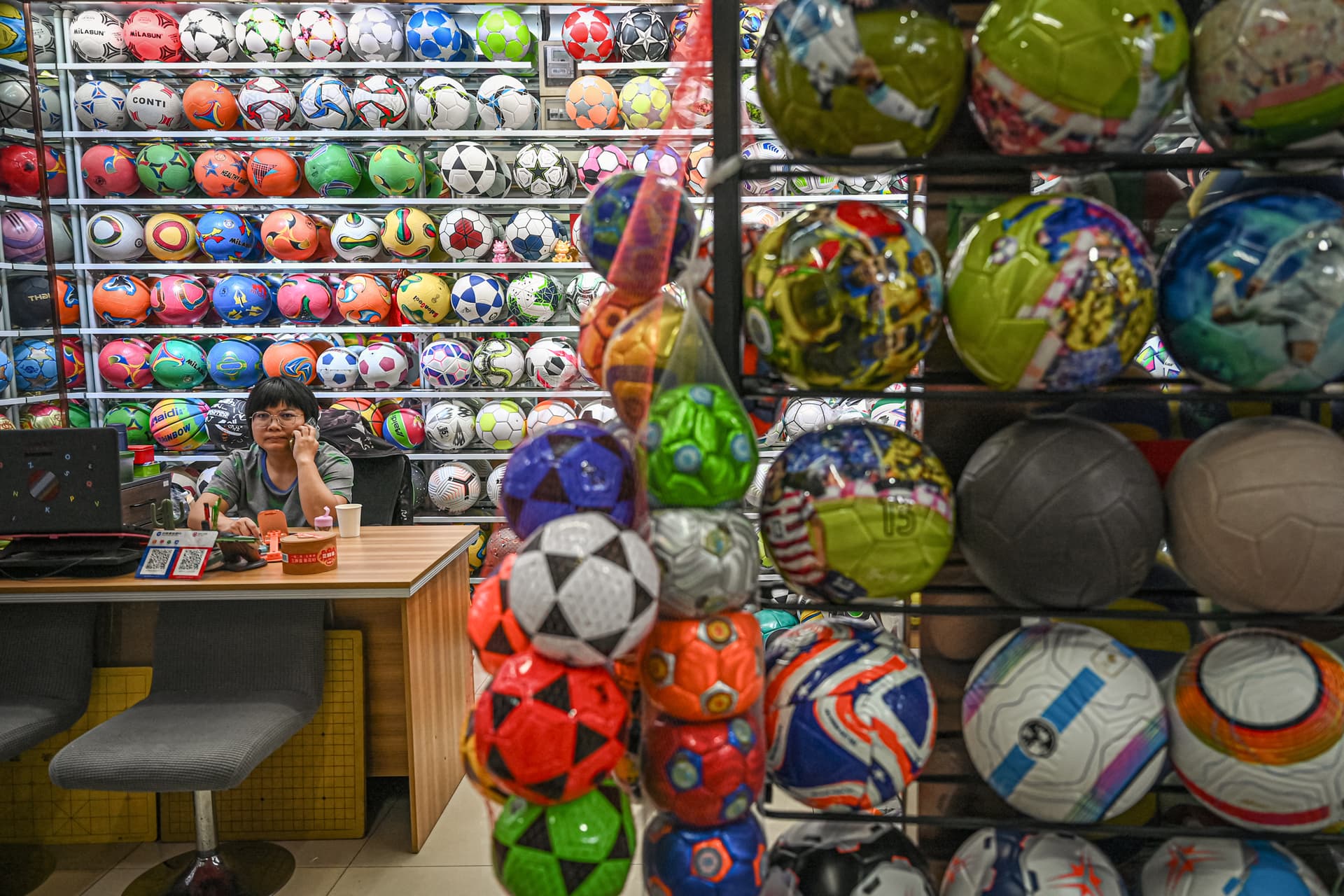 A vendor waits for customers at a sporting goods stall at a trade market in Yiwu, Zhejiang Province, China, on Sept. 17, 2025. As Western countries imposed tariffs on Chinese goods to curb Beijing from flooding their markets with cheap products, the Chinese regime has been forced to look domestically. (Jade Gao/AFP via Getty Images)