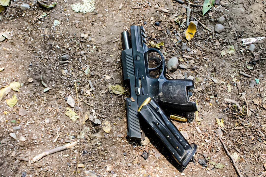 A firearm seized by the Mendocino County Sheriff’s Department during a raid on an illegal cannabis grow site in Northern California. Since Gov. Gavin Newsom established the Unified Cannabis Enforcement Taskforce in 2022, 47 warrants have been served in Mendocino County, leading to four arrests and the seizure of 54 firearms and an estimated $65 billion worth of marijuana plants and harvested cannabis, according to the Department of Cannabis Control. (Courtesy of the Mendocino County Sheriff’s Department)