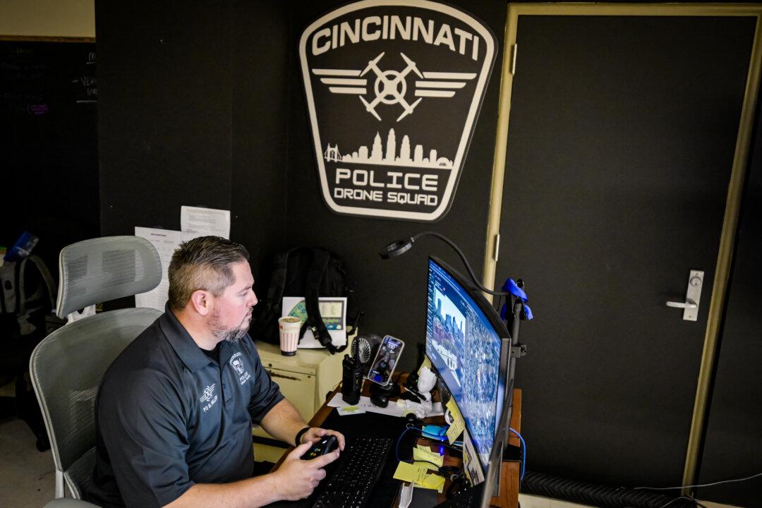 Police Officer Ben Miller pilots a drone and monitors the scene its camera reveals at the Cincinnati Police headquarters in Cincinnati on Sept. 12, 2025. (Malinda Hartong for The Epoch Times)