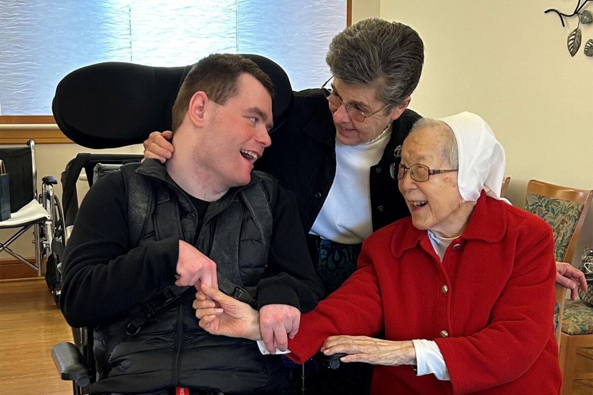 Sister Pacis Bao, OSF (right), Sister Maureen O’Connor, OSF (center), and Tommy Loehrke, the great nephew of Sister Maureen, at St. Francis Convent in Springfield, Ill., on March 27, 2024. (Photo courtesy of Hospital Sisters of St. Francis)
