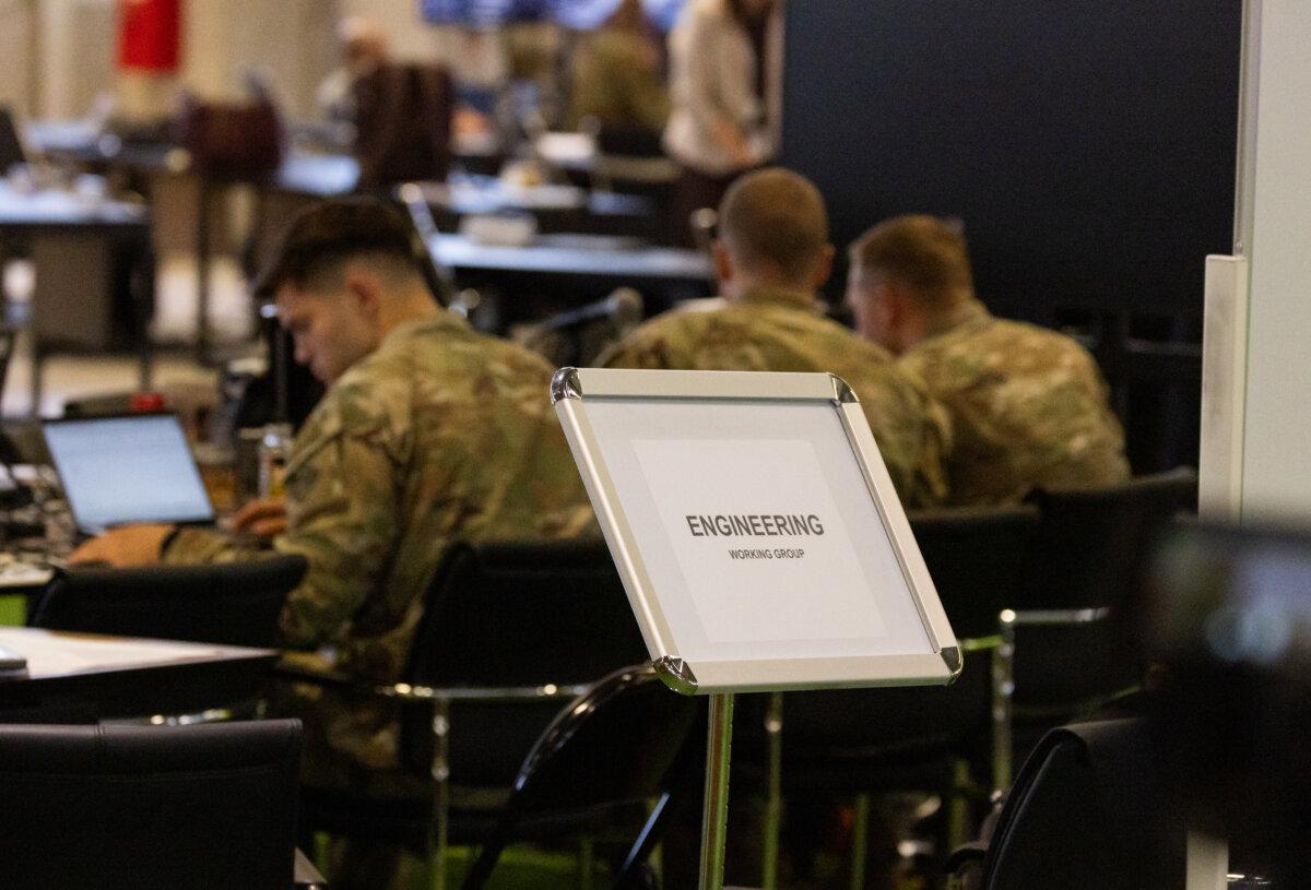 A coalition of U.S., Israeli, and foreign militaries, along with multinational civilian personnel, work together to provide humanitarian assistance for the Gaza Strip at the Civil-Military Coordination Center in Kiryat Gat, Israel, on Nov. 20, 2025. (John Fredricks/The Epoch Times)