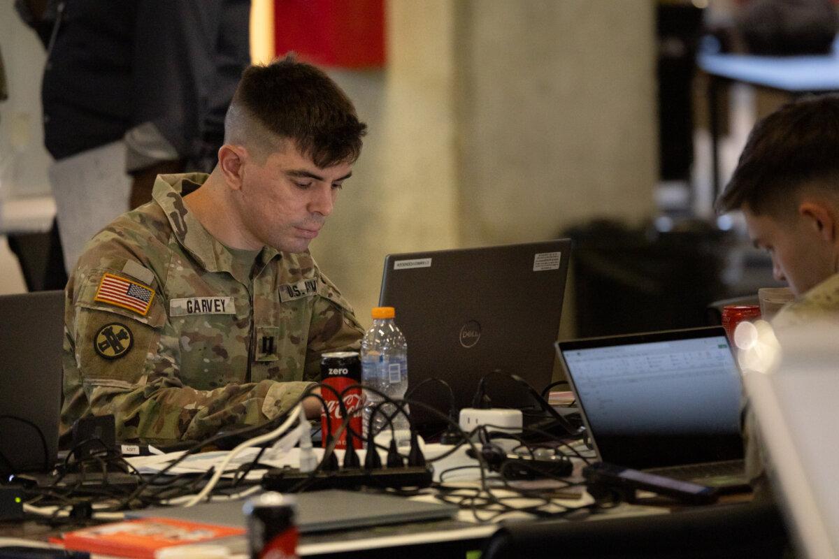U.S. Army soldiers provide logistical assistance for the Gaza Strip at the Civil-Military Coordination Center in Kiryat Gat, Israel, on Nov. 20, 2025. (John Fredricks/The Epoch Times)