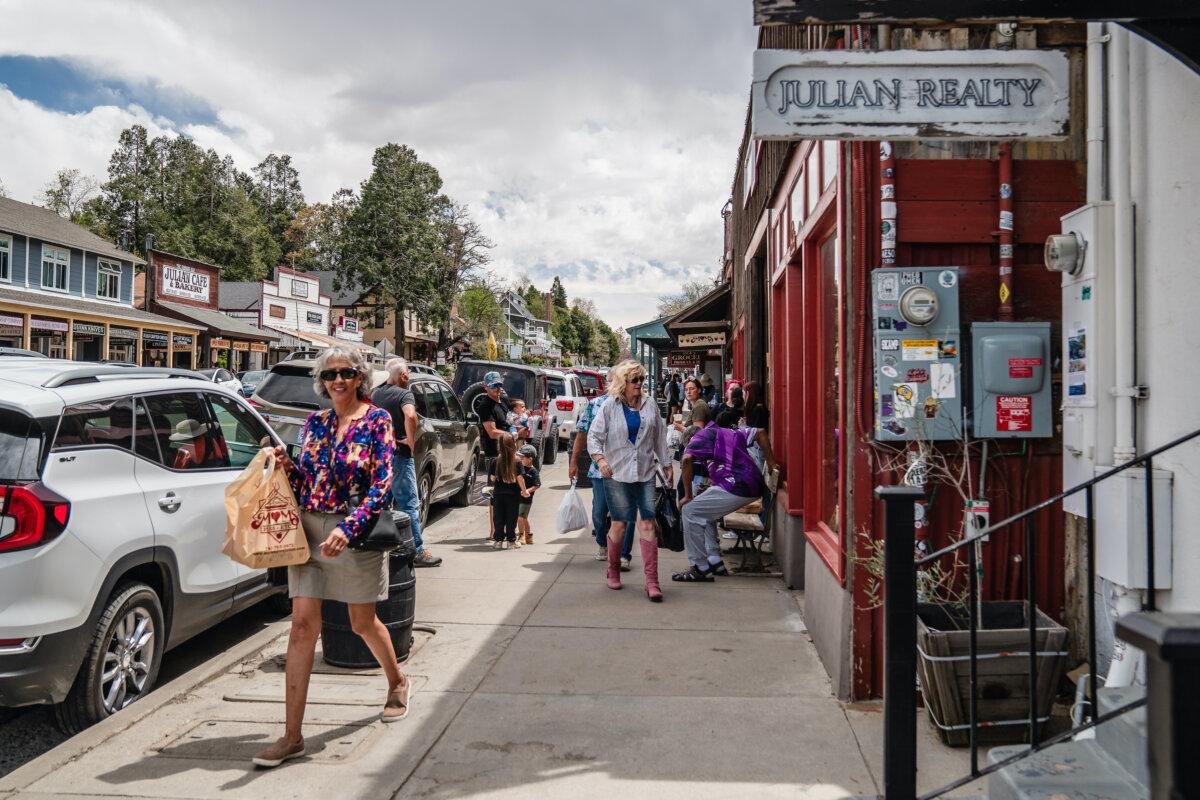 People walk around on Main Street in Julian, Calif., on April 14, 2025. (Ariana Drehsler/Getty Images)