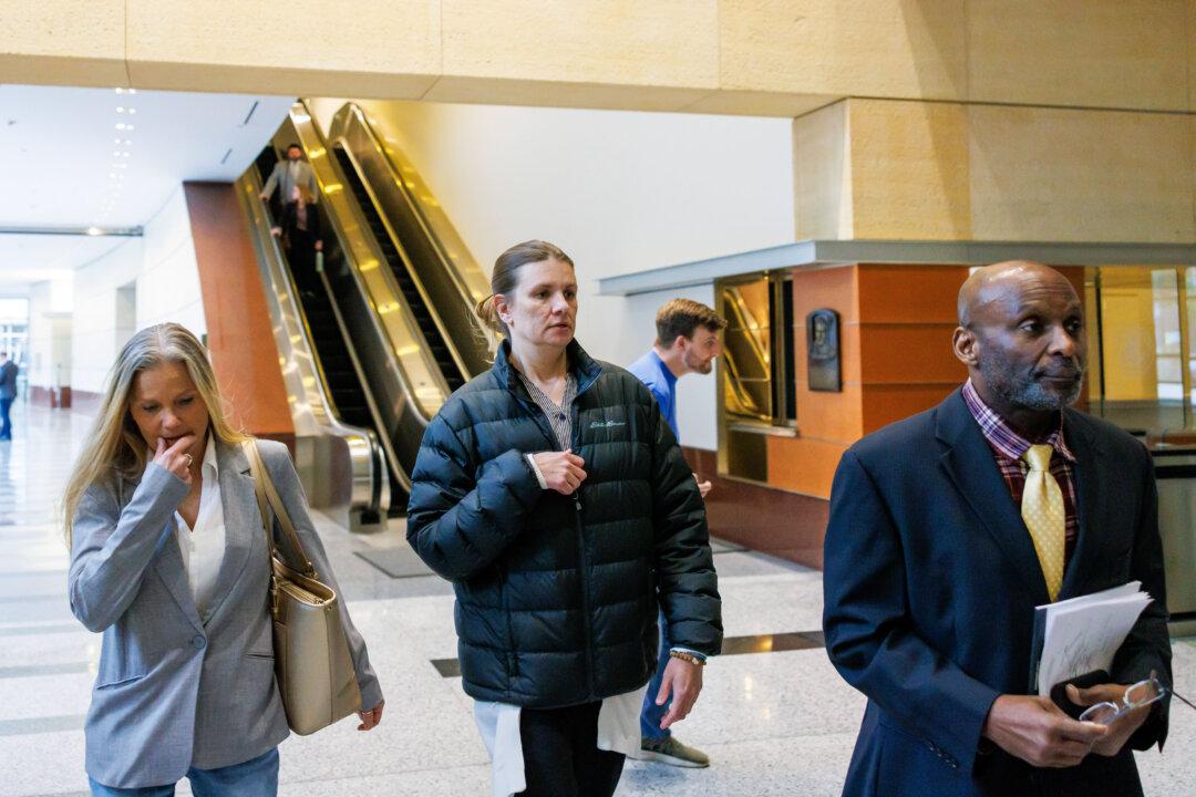 Aimee Bock, founder and executive director of the nonprofit Feeding Our Future, arrives at the Minneapolis federal courthouse with her attorney in Minneapolis on March 19, 2025. The nonprofit is at the center of Minnesota’s largest COVID-19-era fraud scandal involving federal child nutrition funds, in which it allegedly siphoned off nearly half a million dollars. (Kerem Yücel/Minnesota Public Radio via AP)