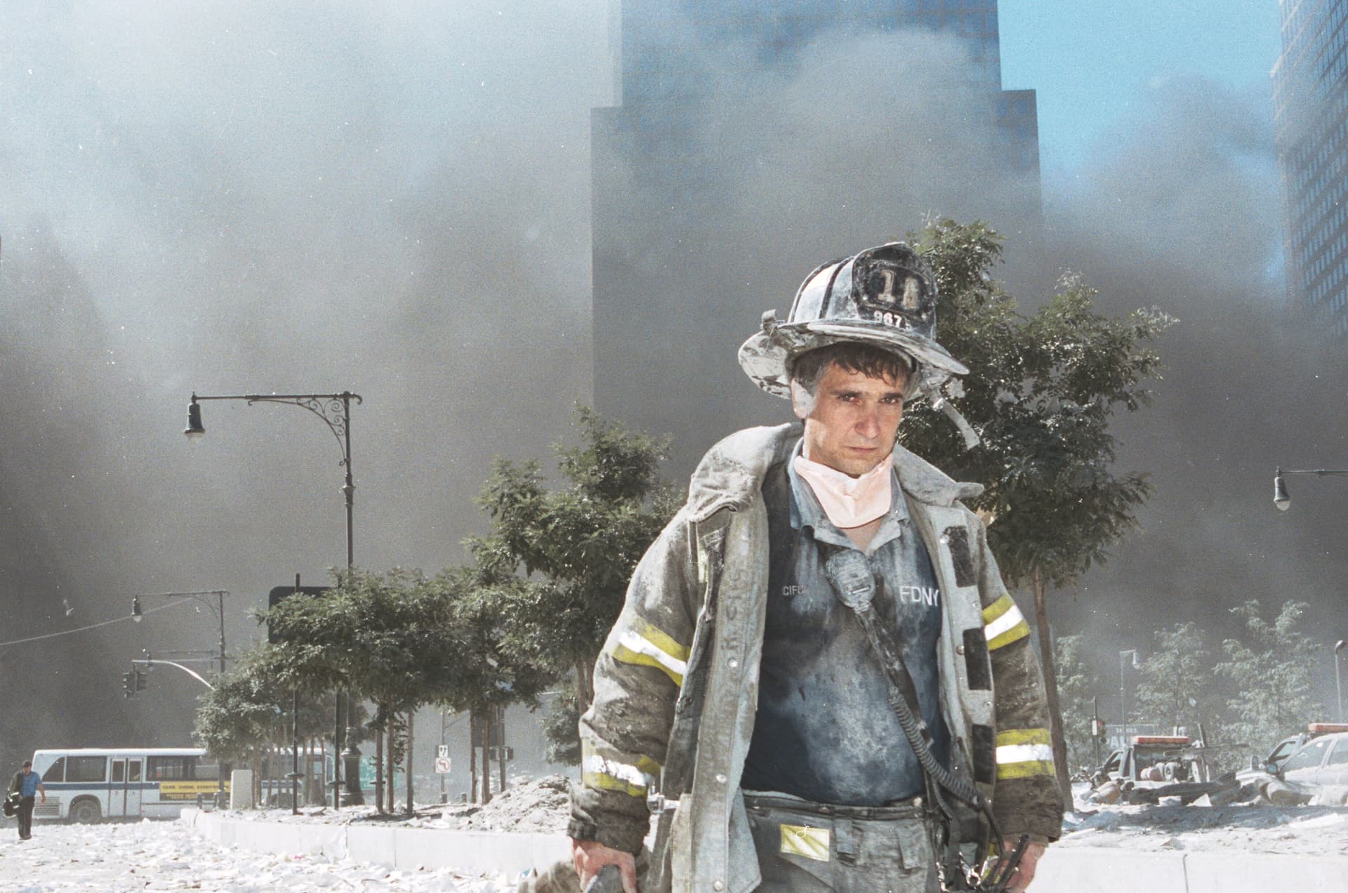 A firefighter walks away from Ground Zero after commercial airplanes hijacked by al-Qaeda terrorists hit the Twin Towers in New York on Sept. 11, 2001. Nearly 3,000 crew members, passengers, and people on the ground were killed as the towers collapsed. (Anthony Correia/Getty Images)