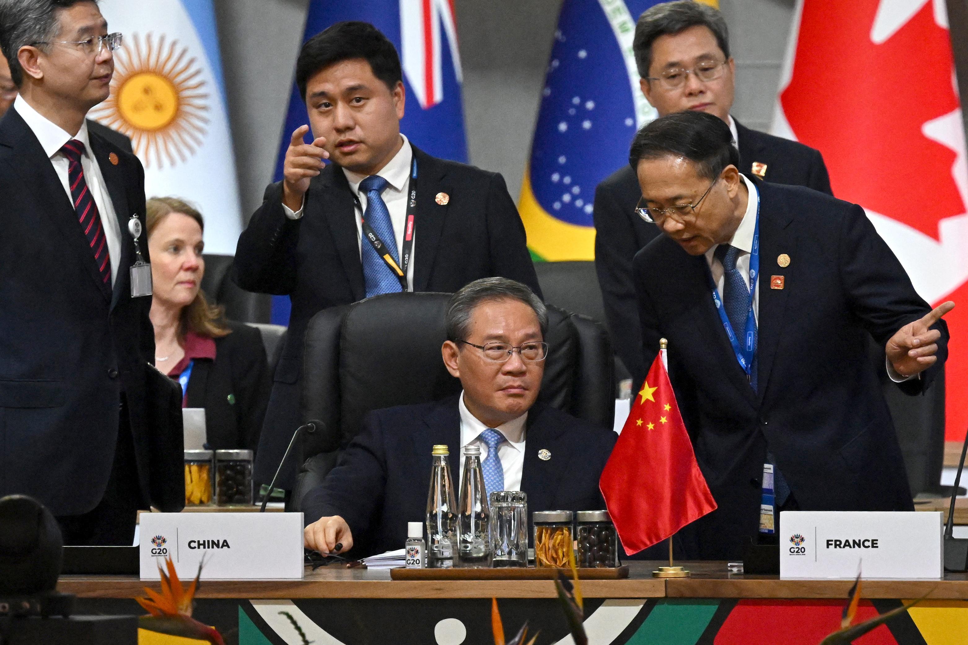 China's Prime Minister Li Qiang (C) attends a G20 Leaders' Summit plenary session at the Nasrec Expo Centre in Johannesburg on November 22, 2025. (Leon Neal / POOL / AFP via Getty Images)