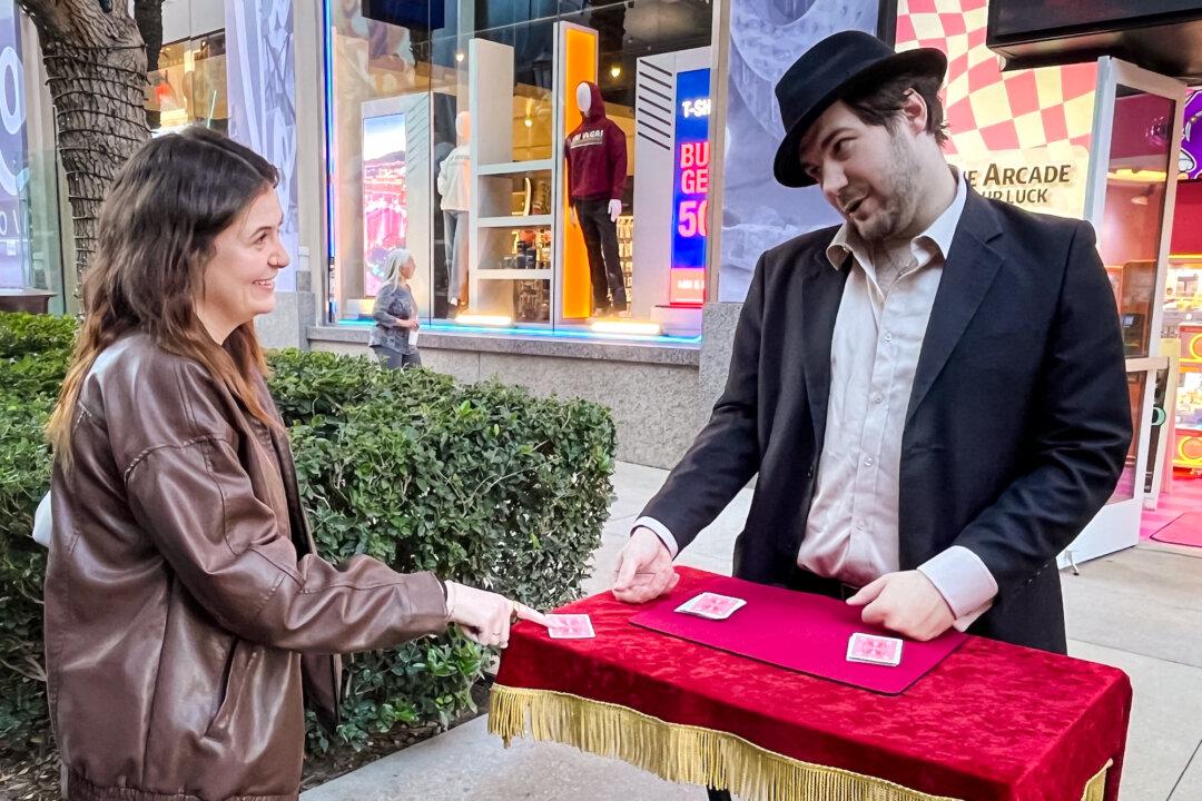 (Top L) A street artist plays the violin on Las Vegas Boulevard on the Strip in Las Vegas on Dec. 9, 2025. (Top R) A street vendor waits for customers on Las Vegas Boulevard on Dec. 8, 2025. (Bottom L) A tourist tries her luck at a card table near The Linq Promenade in Las Vegas on Dec. 9, 2025. (Bottom R) Tourists ride a zip line over the Strip in Las Vegas on Dec. 9, 2025. (Allan Stein/The Epoch Times)
