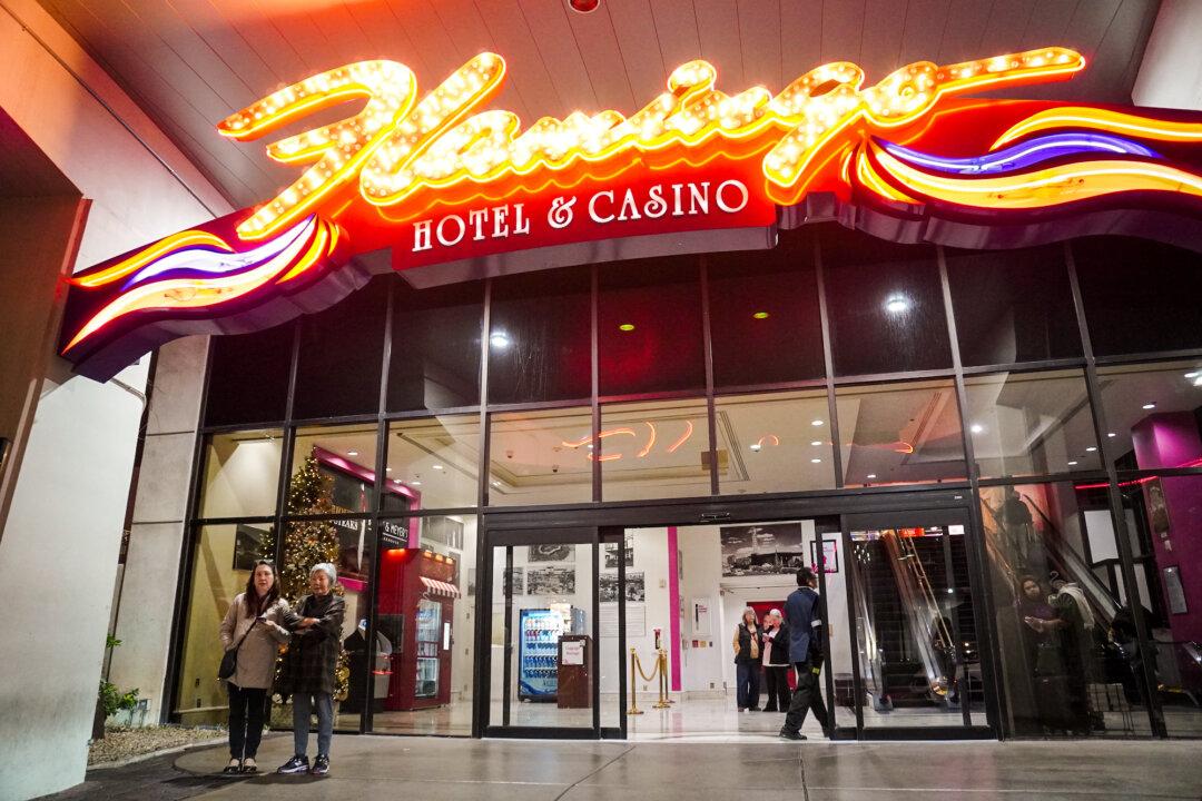 Visitors enter the Flamingo Las Vegas hotel and casino in Las Vegas on Dec. 9, 2025. Between January and October, more than 32 million people visited the city, a 7.6 percent drop from 2024, according to the Las Vegas Convention and Visitors Authority. (Allan Stein/The Epoch Times)