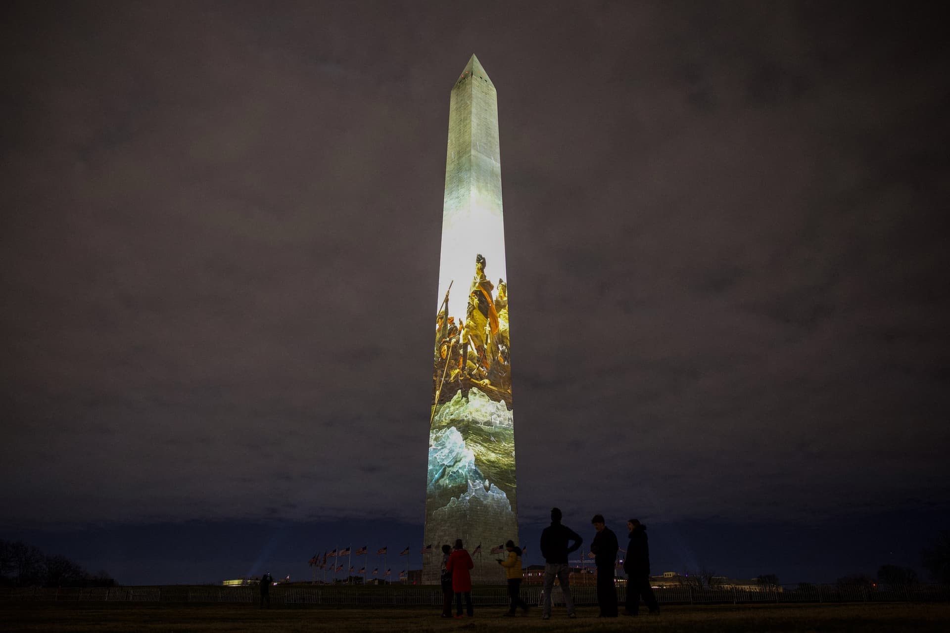 The Washington Monument is illuminated with a projection of President Donald Trump's "Freedom 250" initiative during the New Year's Eve show at the National Mall in Washington on Dec. 31, 2025. (Amid FARAHI/AFP via Getty Images)