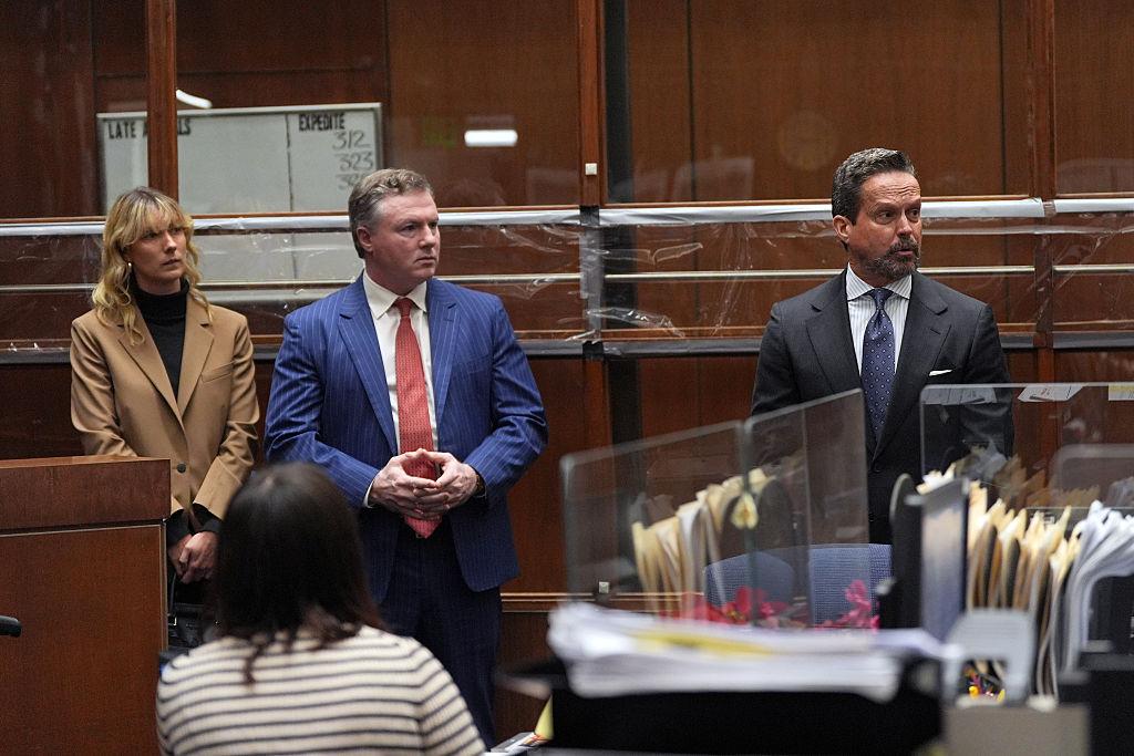 Alan Jackson (R), attorney of Nick Reiner, appears in court to defend Reiner on murder charges in Los Angeles on Dec. 17, 2025. The judge requested that no photographs of Reiner be taken in court, and two people (left and center) were positioned to block Reiner, who was sitting behind them. (Jae C. Hong-Pool/Getty Images)