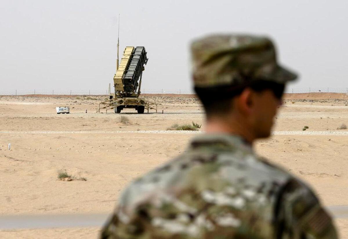 A member of the U.S. Air Force stands near a Patriot missile battery at Prince Sultan Air Base in Saudi Arabia, on Feb. 20, 2020. (Andrew Caballero-Reynolds/Pool via AP, File)
