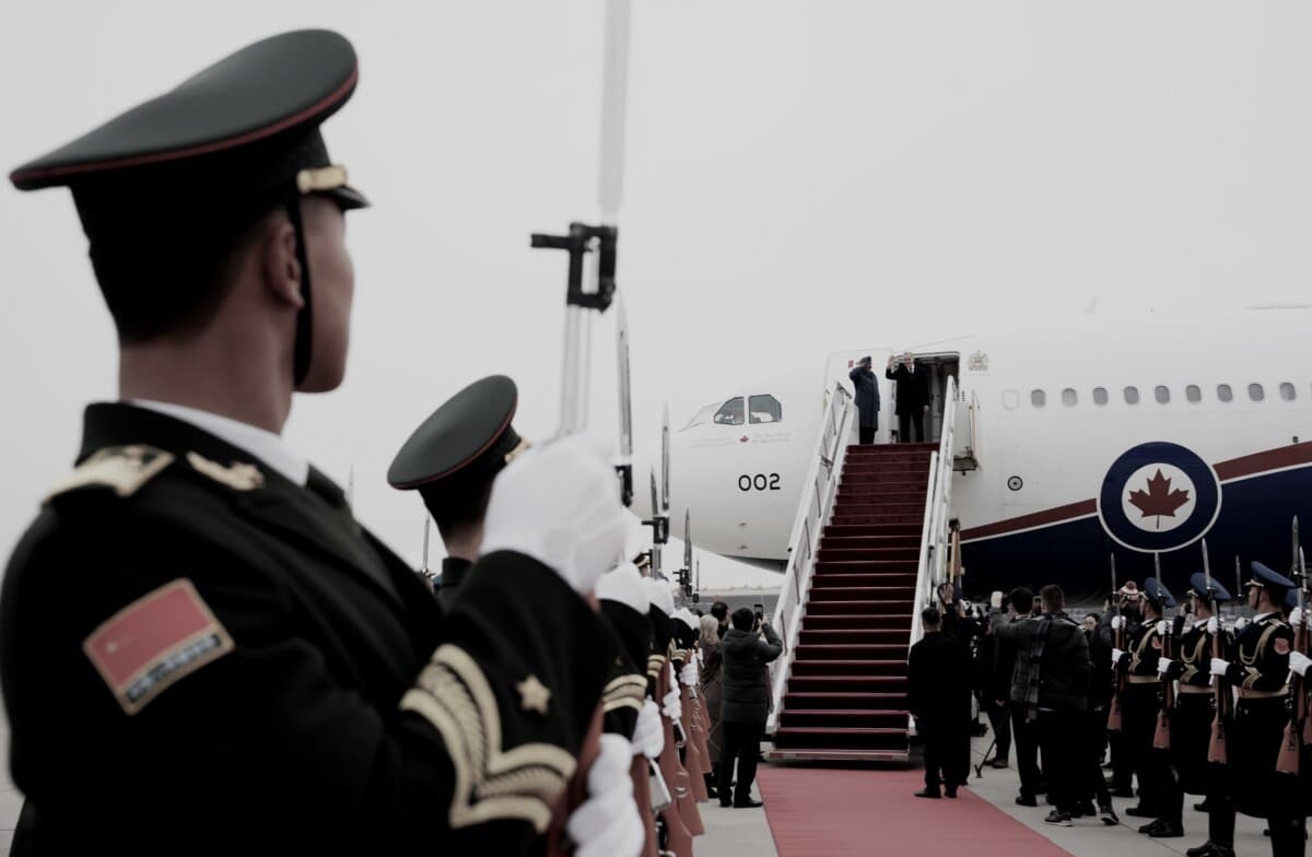 Prime Minister Mark Carney waves as he departs Beijing on Jan. 17, 2026, on route to Doha, Qatar. (The Canadian Press/Sean Kilpatrick)