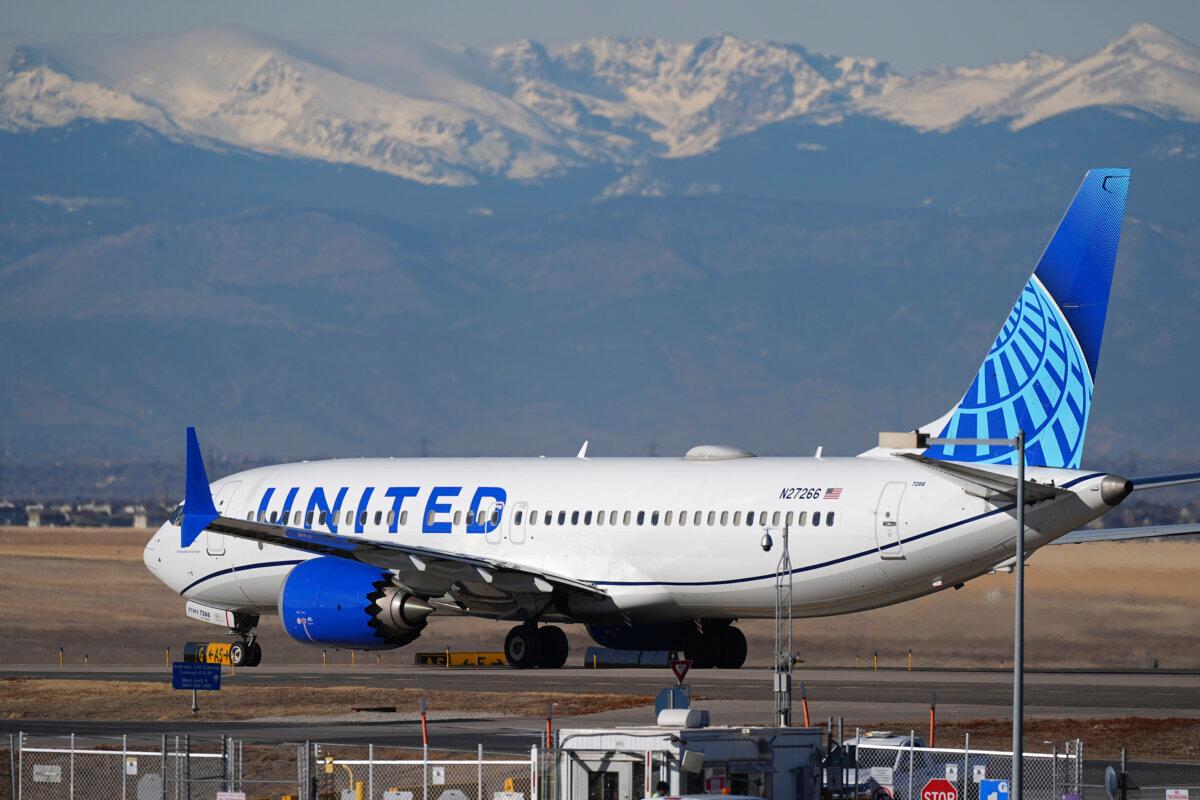A United Airlines jetliner taxis down a runway for takeoff at Denver International Airport on Dec. 24, 2024. (David Zalubowski/AP Photo)