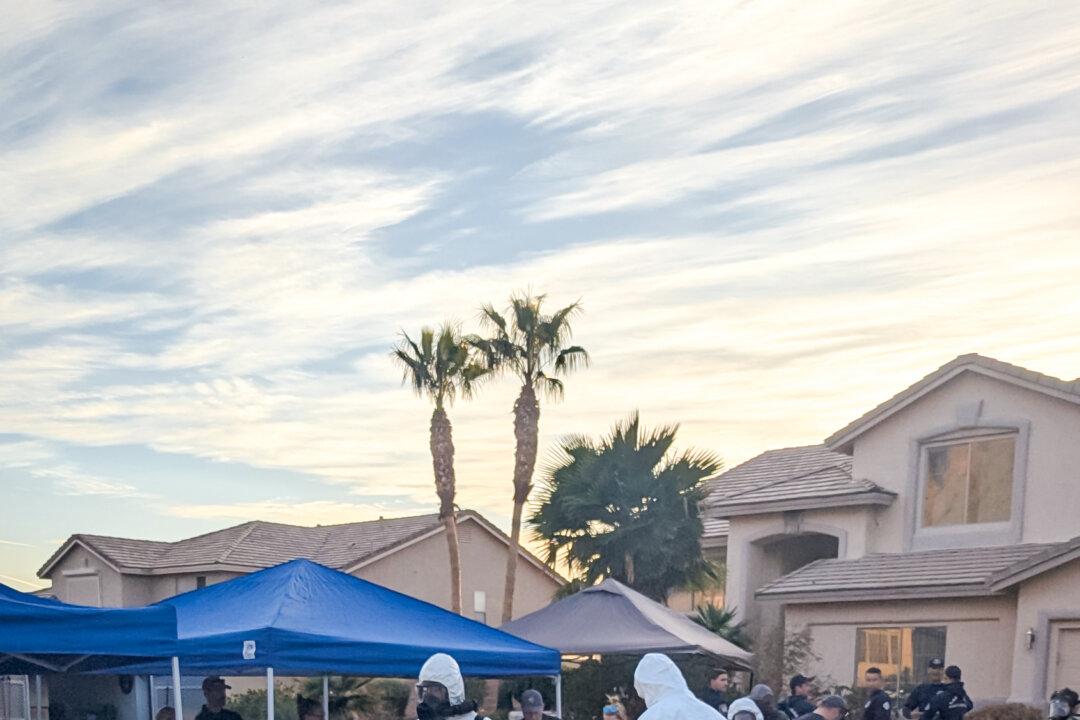 Authorities discovered a freezer, several refrigerators, specialized lab equipment, and more than 1,000 vials and gallon-size containers of unknown red and brown liquids in the garage while searching a house on Sugar Springs Drive in Las Vegas on Jan. 31, 2026. (FBI)