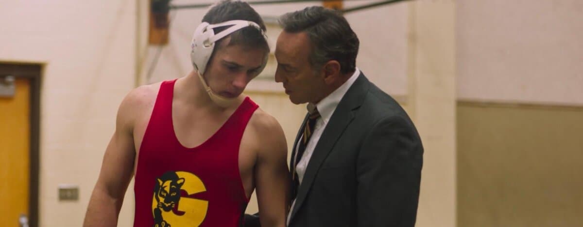 Scott Baker (Casey Moss, L) gets advice from wrestling coach Frank Stevens (Peter Onorati), in “The Last Champion.” (Redburn Street Pictures)