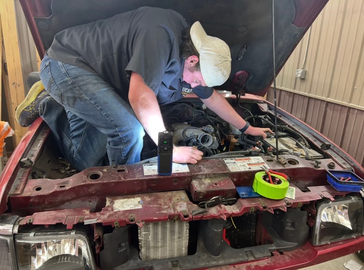 Isaac Rodden working on his car. (Courtesy of Heather Rodden)