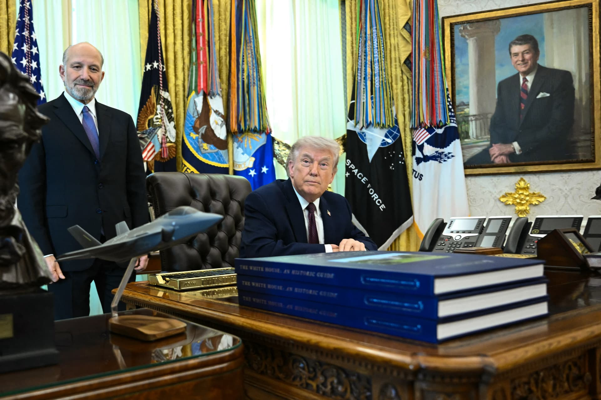 Secretary of Commerce Howard Lutnick (L) and President Donald Trump look on before signing an executive order on election integrity in the Oval Office of the White House on March 31, 2026. (Brendan Smialowski/AFP via Getty Images)
