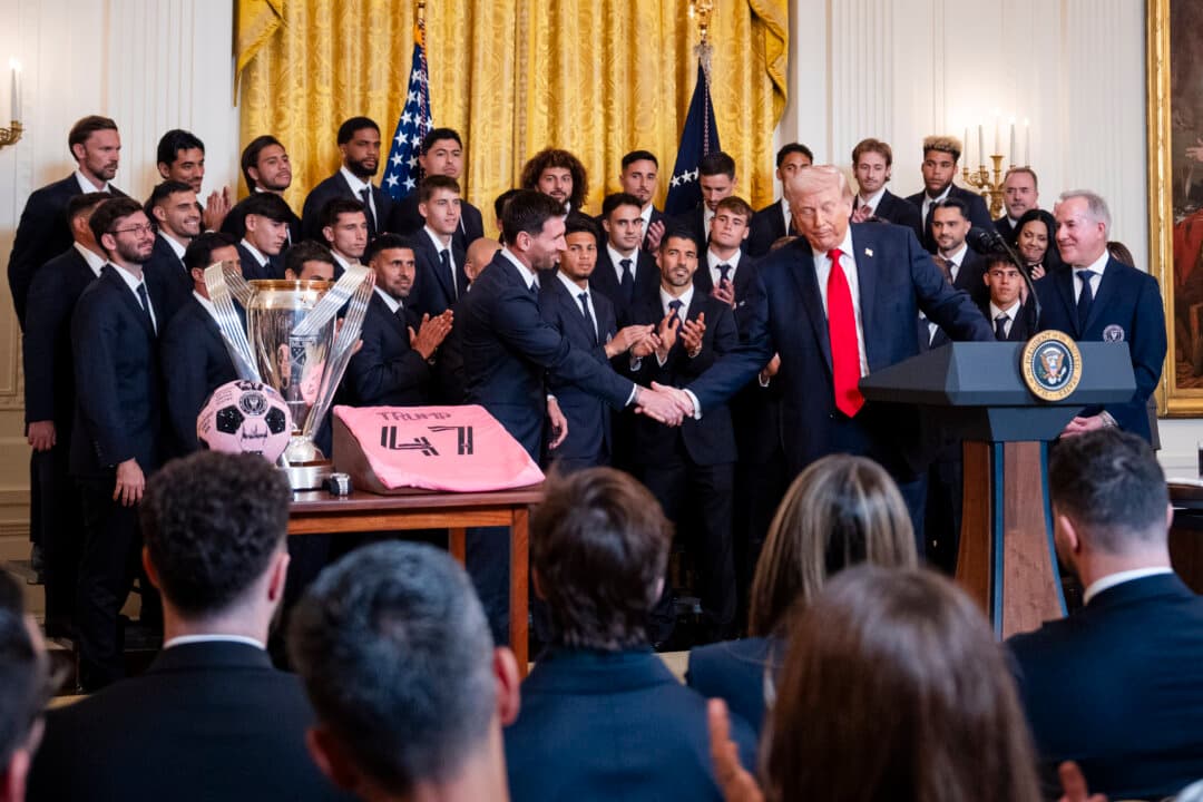 President Donald Trump shakes hands with soccer player Lionel Messi at the White House on March 5, 2026. (Madalina Kilroy/The Epoch Times)