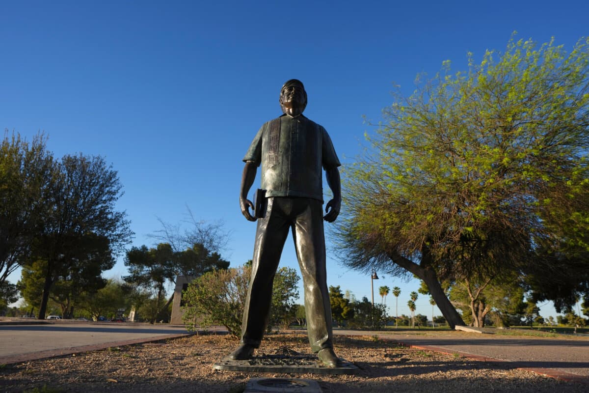 A statue of Cesar Chavez stands in the middle of a plaza at Cesar Chavez Park, honoring the United Farm Workers union founder in Laveen, Ariz., on March 18, 2026. (AP Photo/Ross D. Franklin)
