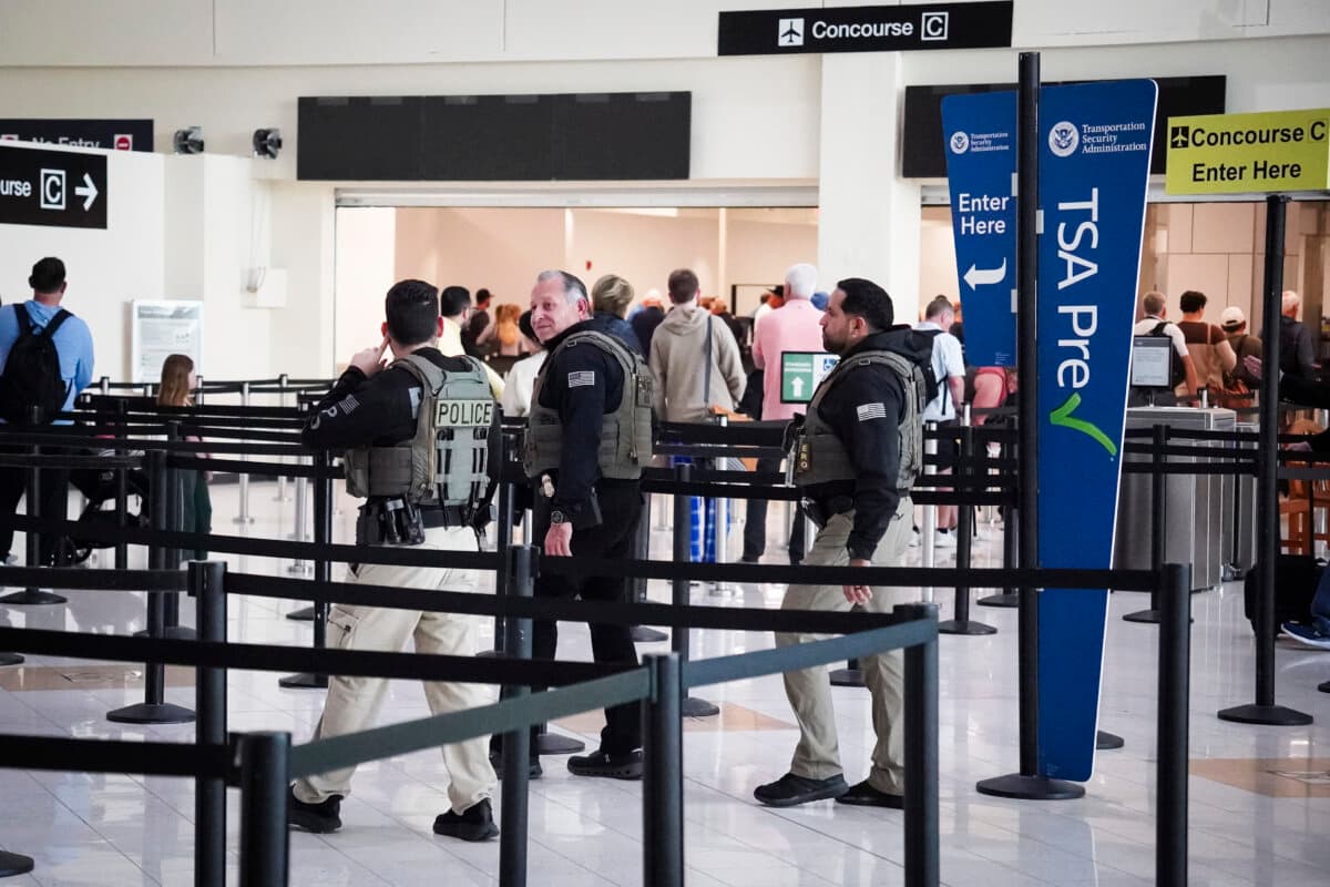Travelers line up at the security checkpoint area at Southwest Florida International Airport in Fort Myers, Fla., on March 23, 2026, as the Homeland Security Department deploys Immigration and Customs Enforcement agents to help the Transportation Security Administration at some airports. (Jacob Burg/The Epoch Times)