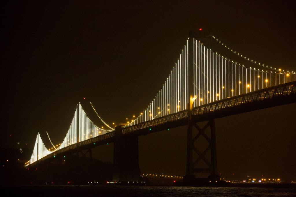 The San Francisco-Oakland Bay Bridge is illuminated with artist Leo Villareal's Bay Lights sculpture in San Francisco on March 5, 2013. (Stephen Lam/Getty Images)