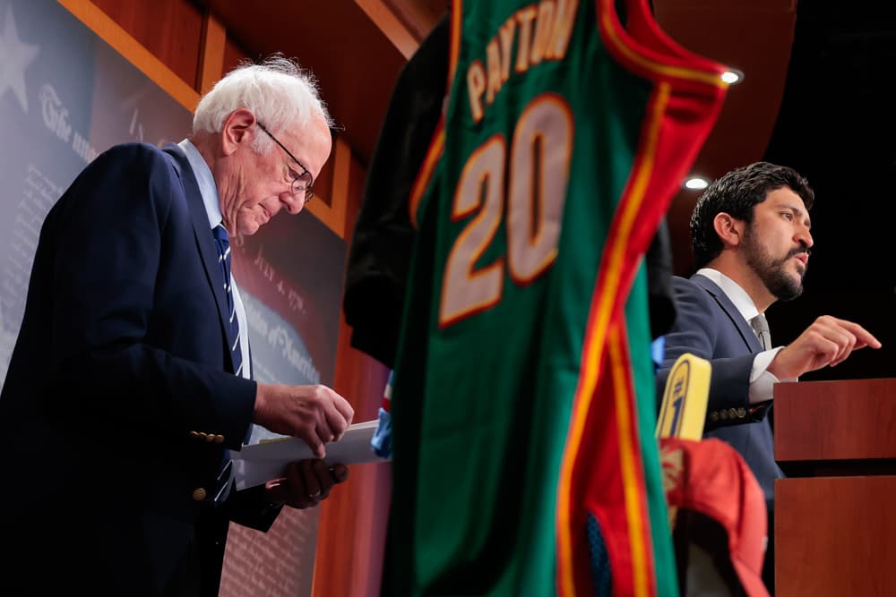 Rep. Greg Casar (D-Tex.) (R) and Sen. Bernie Sanders (I-Vt.) (L) introduce a bill meant to protect sports fans and taxpayers from professional sports team relocations at the U.S. Capitol in Washington on March 26, 2026. (Heather Diehl/Getty Images)