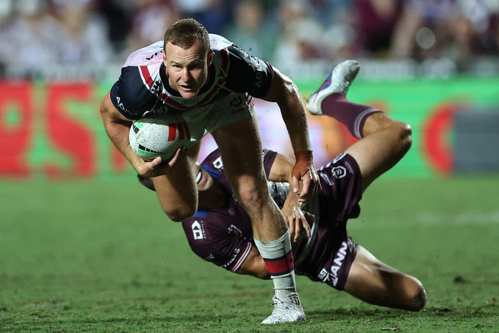 Daly Cherry-Evans of the Roosters breaks through a tackle during the round four NRL match between the Manly Sea Eagles and Sydney Roosters at 4 Pines Park, in Sydney, Australia, on March 26, 2026. (Cameron Spencer/Getty Images)