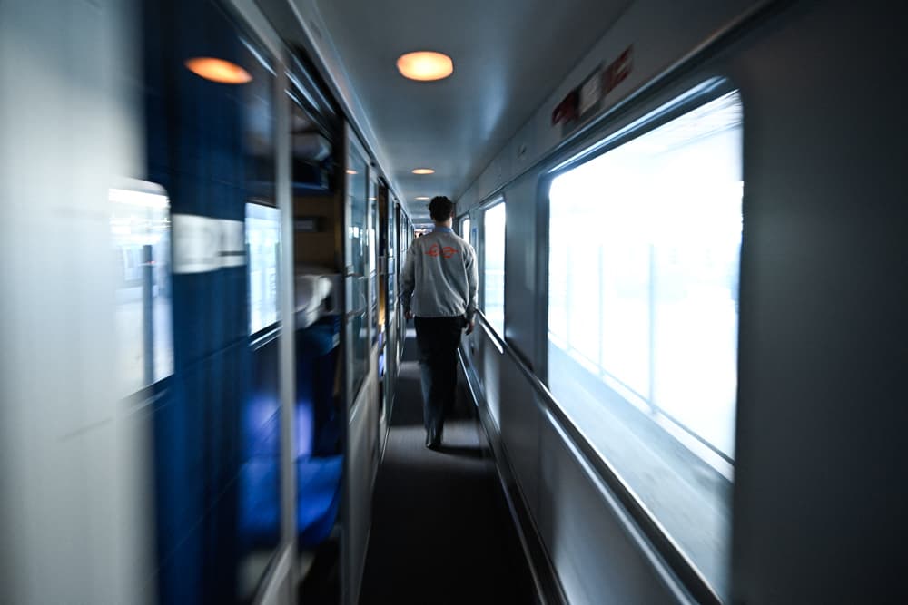 An employee walks in the first night train operated by the Dutch-Belgian railway cooperative European Sleeper, which runs the Paris-Berlin line, as it departs from Gare du Nord in Paris, on March 26, 2026. (Julien De Rosa/AFP via Getty Images)