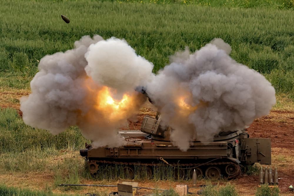 An Israeli self-propelled howitzer artillery gun fires rounds toward southern Lebanon from a position in upper Galilee, in northern Israel, on March 26, 2026. (Jack Guez/AFP via Getty Images)