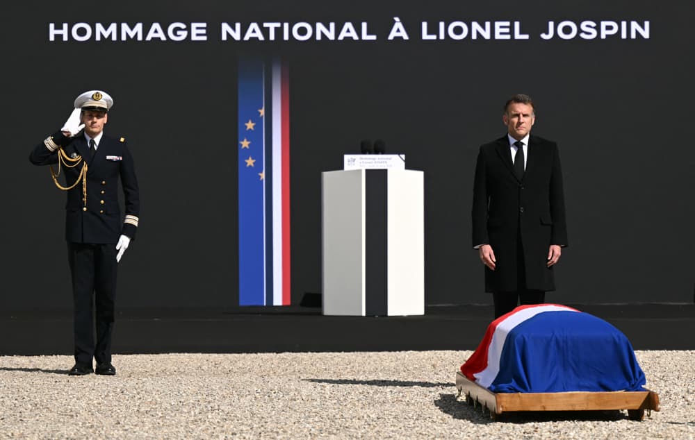 France's President Emmanuel Macron pays his respects at the coffin of Lionel Jospin during a national tribute to the former French Prime Minister at the Hotel des Invalides in Paris on March 26, 2026. (Bertrand Guay/AFP via Getty Images)