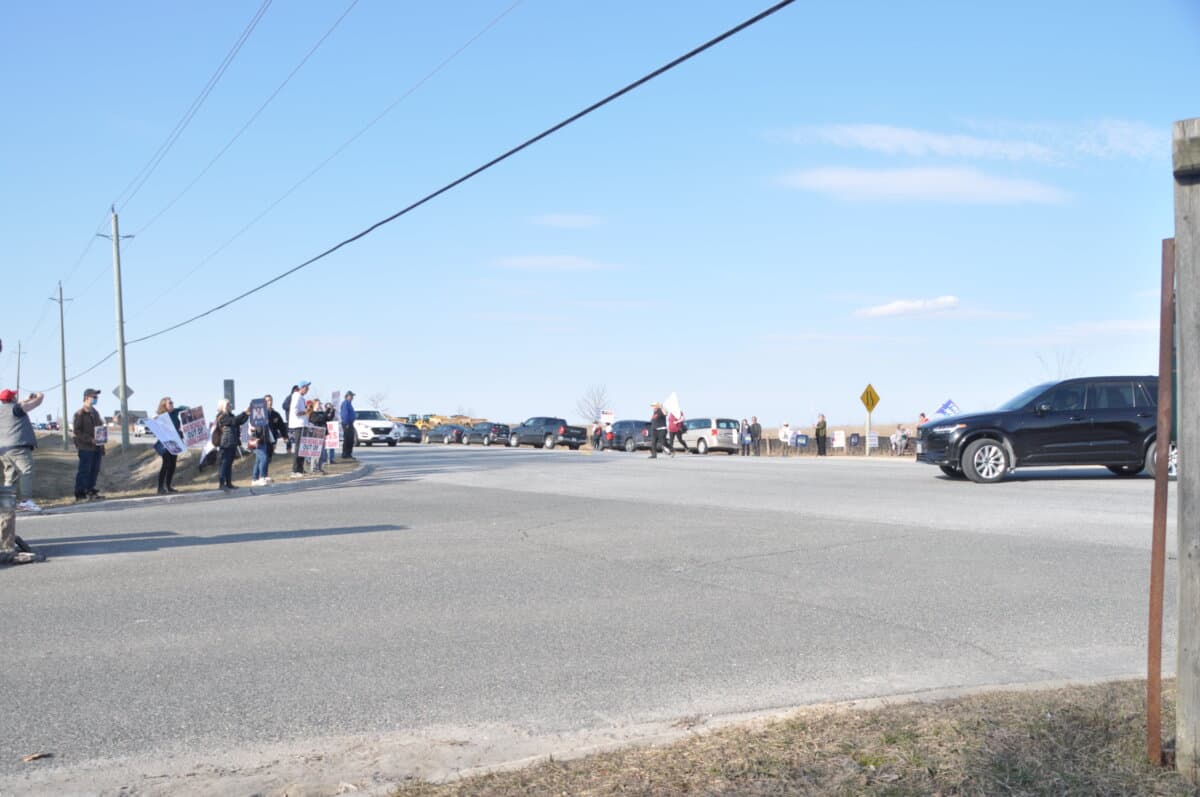 Protesters gather near a venue hosting a fundraiser co-hosted by Liberal MP Michael Ma in Markham, Ont., on March 30, 2026. (Allen Zhang/The Epoch Times)