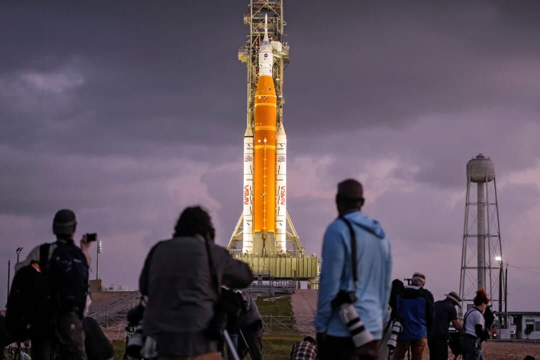 Photographers set up remote cameras near NASA’s Artemis II moon rocket on Launch Pad 39B just before sunrise at Kennedy Space Center in Cape Canaveral, Fla., March 31, 2026. (Chris O'Meara/AP Photo)