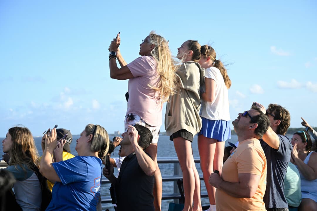 Spectators view NASA’s Artemis II moon rocket launch from the A. Max Brewer Bridge, in Titusville, Fla., on April 1, 2026. (Phelan M. Ebenhack/AP Photo)