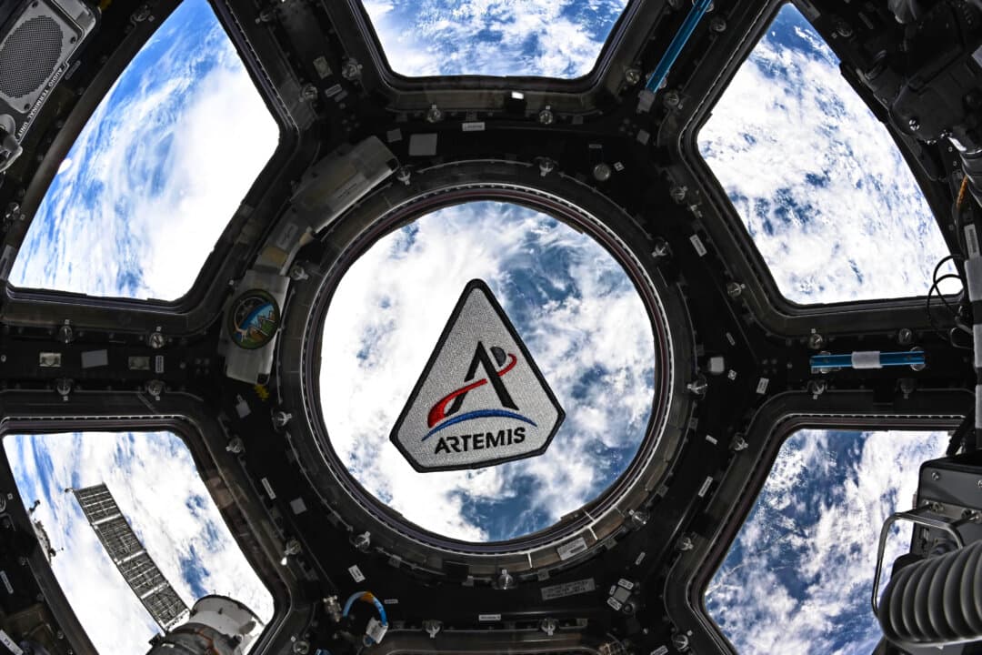 An Artemis program patch floating in the International Space Station’s cupola on March 30, 2026. (Jessica Meir/NASA via AP)