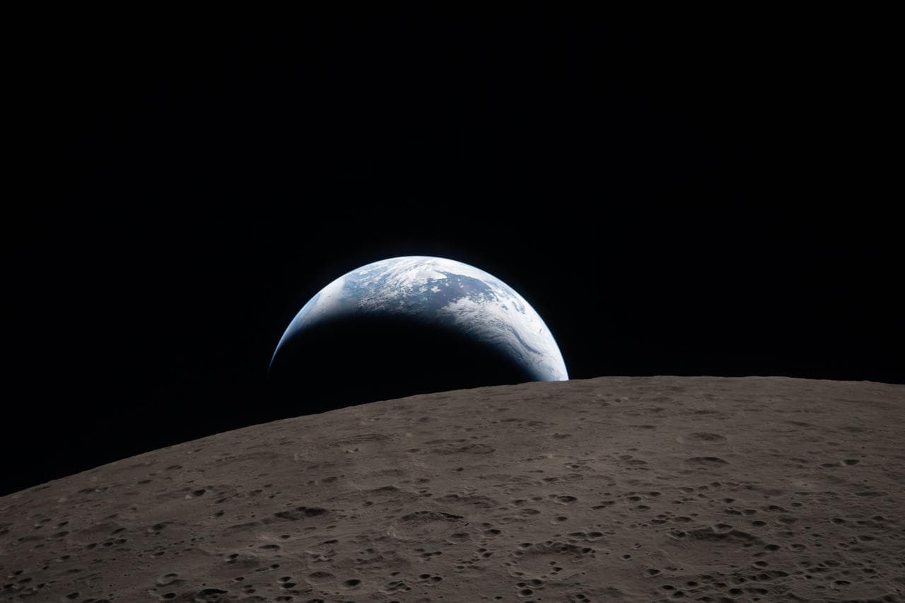 Earthset captured through the Orion spacecraft window at 6:41 p.m. ET on April 6, 2026, during the Artemis II crew’s flyby of the moon. (Courtesy of NASA)