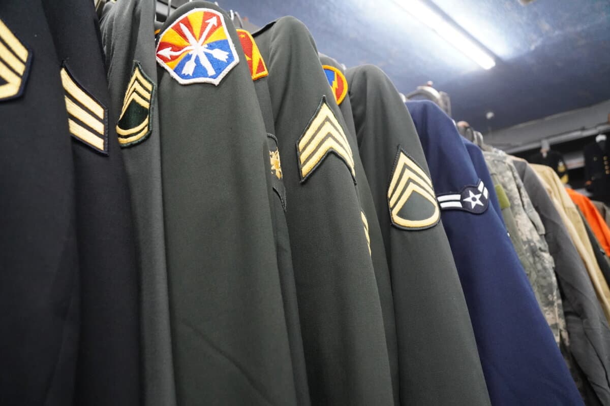 Authentic military uniforms at Miller's Surplus in Tucson, Ariz., on April 4, 2026. (Allan Stein/The Epoch Times)