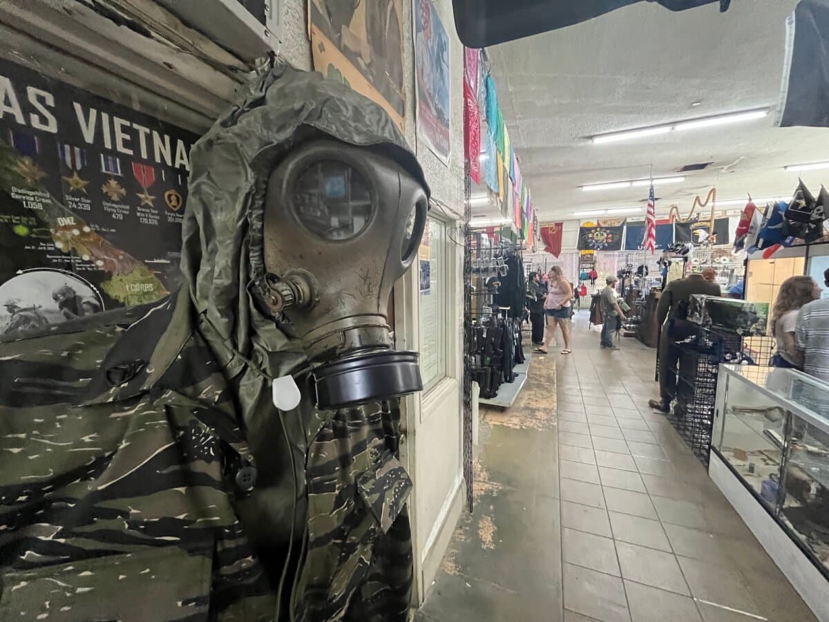 A military-grade gas mask completes a hazardous materials outfit at Miller's Surplus in Tucson, Ariz., on April 4, 2026. (Allan Stein/The Epoch Times)