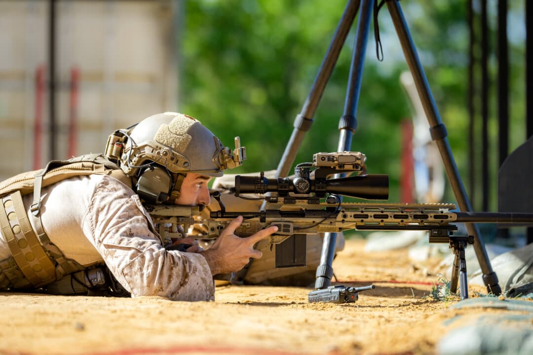 (Left, Right) U.S. Marine Staff. Sgt. Tyler Johnson of the U.S. Marine Corps performs shooting exercises during the International Sniper Competition at Infantry Week at Fort Benning, Ga., on April 8, 2026. Johnson and his teammate, Sgt. Spencer Harrell, won the competition. (John Fredricks/The Epoch Times)