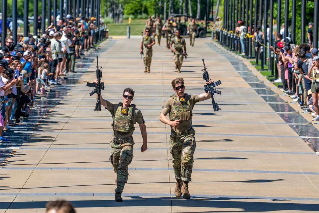 Spc. Caleb Godbold (L) and Sgt. Drew Schorsch of the 75th Ranger Regiment cross the finish line during the Best Ranger Competition at the National Infantry Museum in Columbus, Ga., on April 12, 2026. (Patrick A. Albright/U.S. Army)