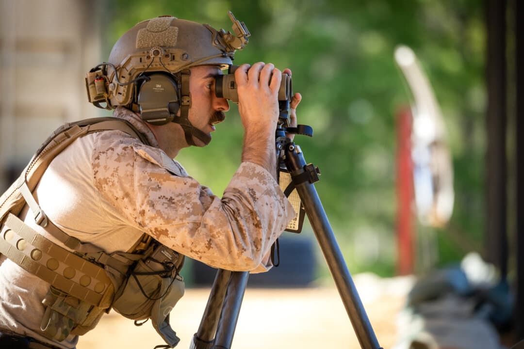 (Left, Right) U.S. Marine Staff. Sgt. Tyler Johnson of the U.S. Marine Corps performs shooting exercises during the International Sniper Competition at Infantry Week at Fort Benning, Ga., on April 8, 2026. Johnson and his teammate, Sgt. Spencer Harrell, won the competition. (John Fredricks/The Epoch Times)