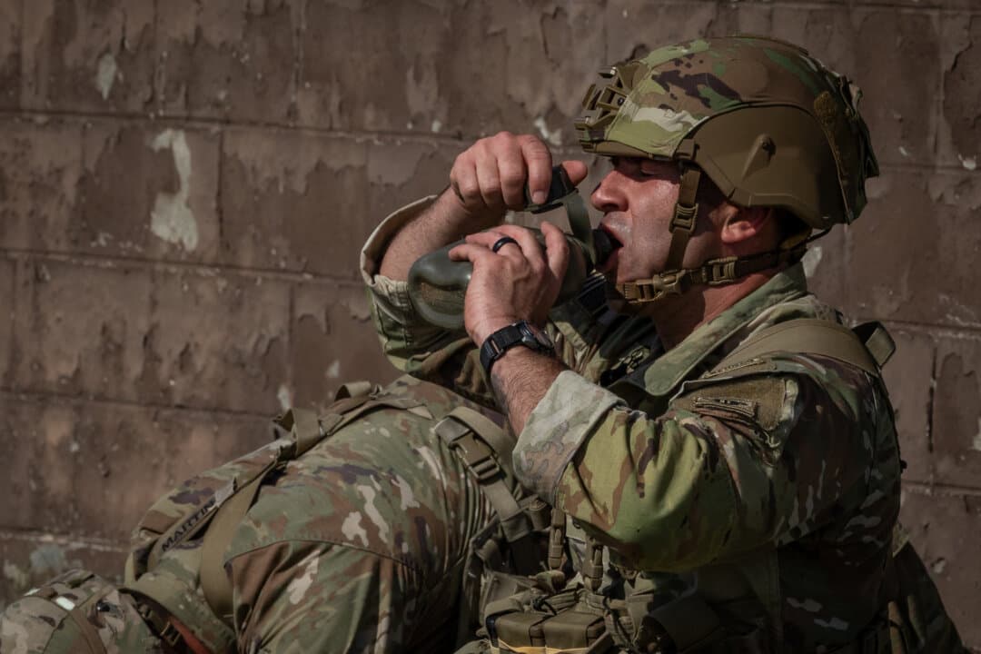 Soldiers of the United States Army perform combat exercises at Fort Benning, Ga., on April 9, 2026. (John Fredricks/The Epoch Times)
