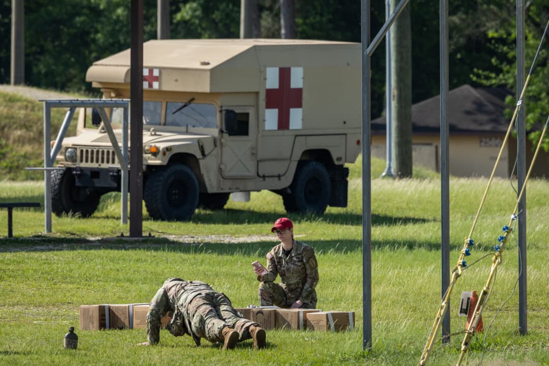 Soldiers of the United States Army participate in combat exercises at Fort Benning, Ga., on April 9, 2026. (John Fredricks/The Epoch Times)