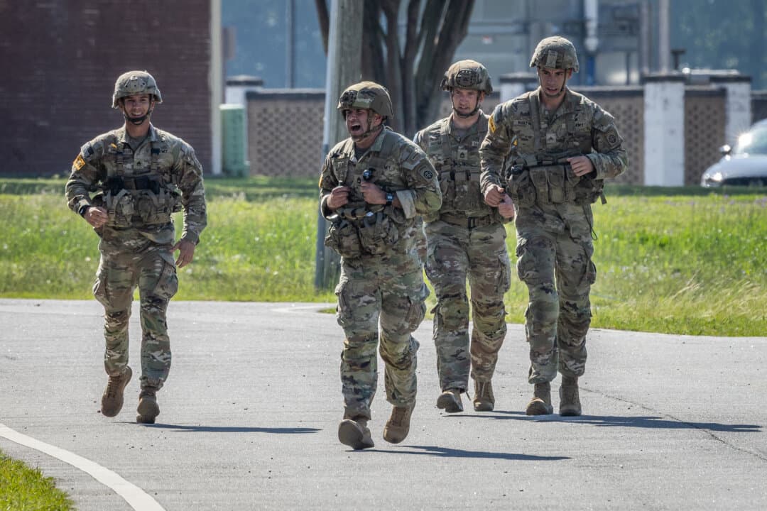 Soldiers with the United States Army perform combat exercises at Fort Benning, Ga., on April 9, 2026. (John Fredricks/The Epoch Times)