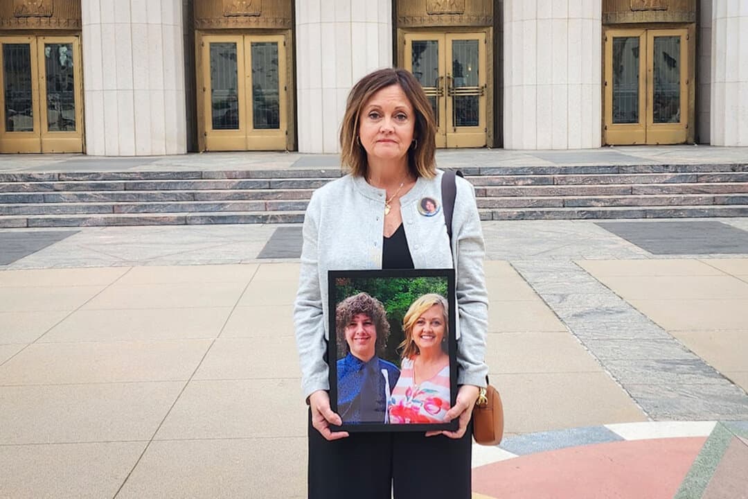 Joann Bogard holds a photo of herself with her son, Mason, at Los Angeles Superior Court in Los Angeles on Feb. 5, 2026. Mason died at age 15 in 2019 after attempting a viral “choking challenge” on YouTube. (Courtesy of Joann Bogard)