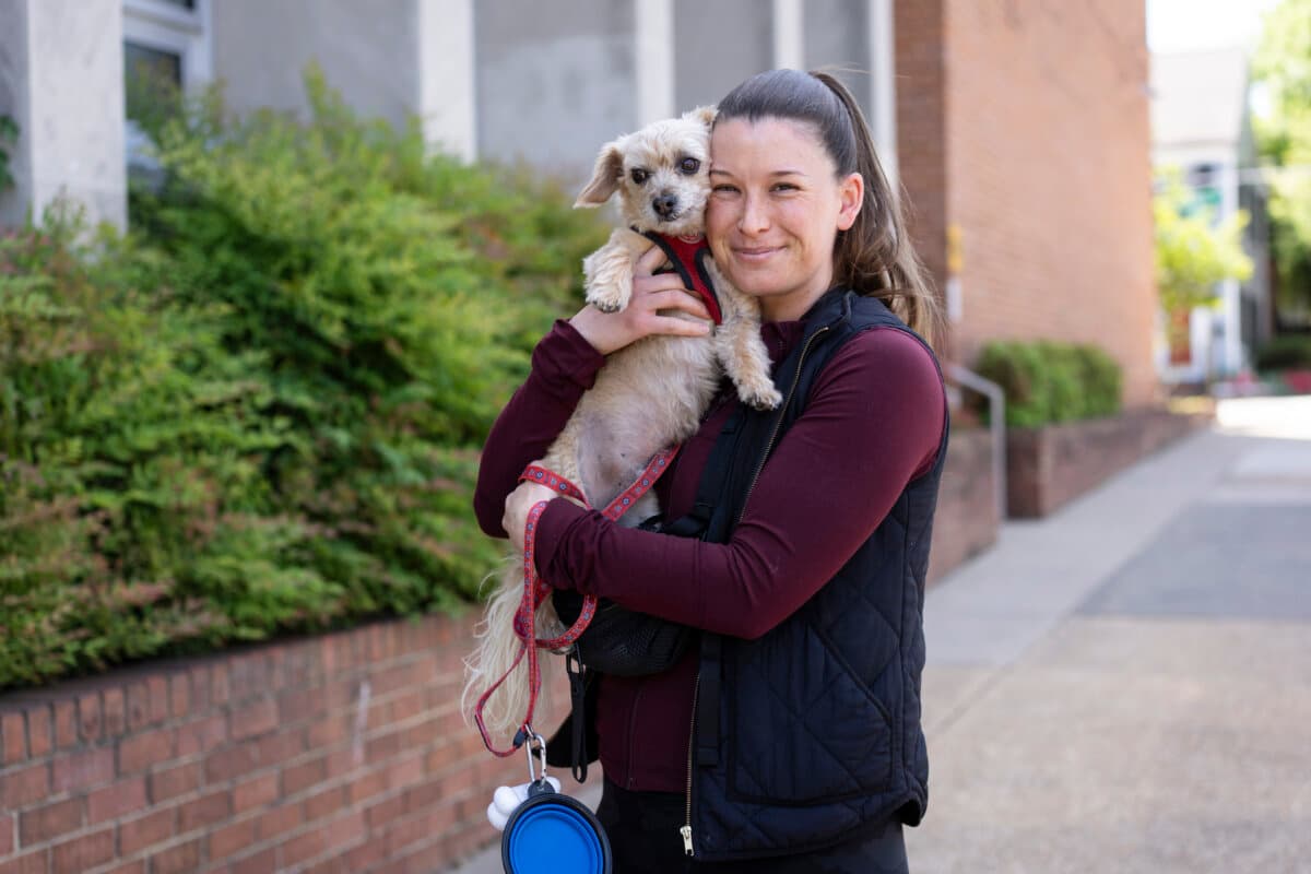 Lara Meehan and her dog Gigi after voting in the redistricting referendum in Alexandria, Va., on April 21, 2026. (Madalina Kilroy/The Epoch Times)