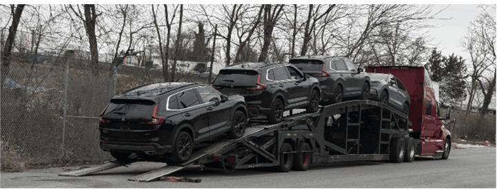 A car transporter in Maryland was loaded with several of the recovered vehicles from an alleged international auto-theft ring that federal authorities say was connected to six people in the Washington metropolitan area. (U.S. DOJ)