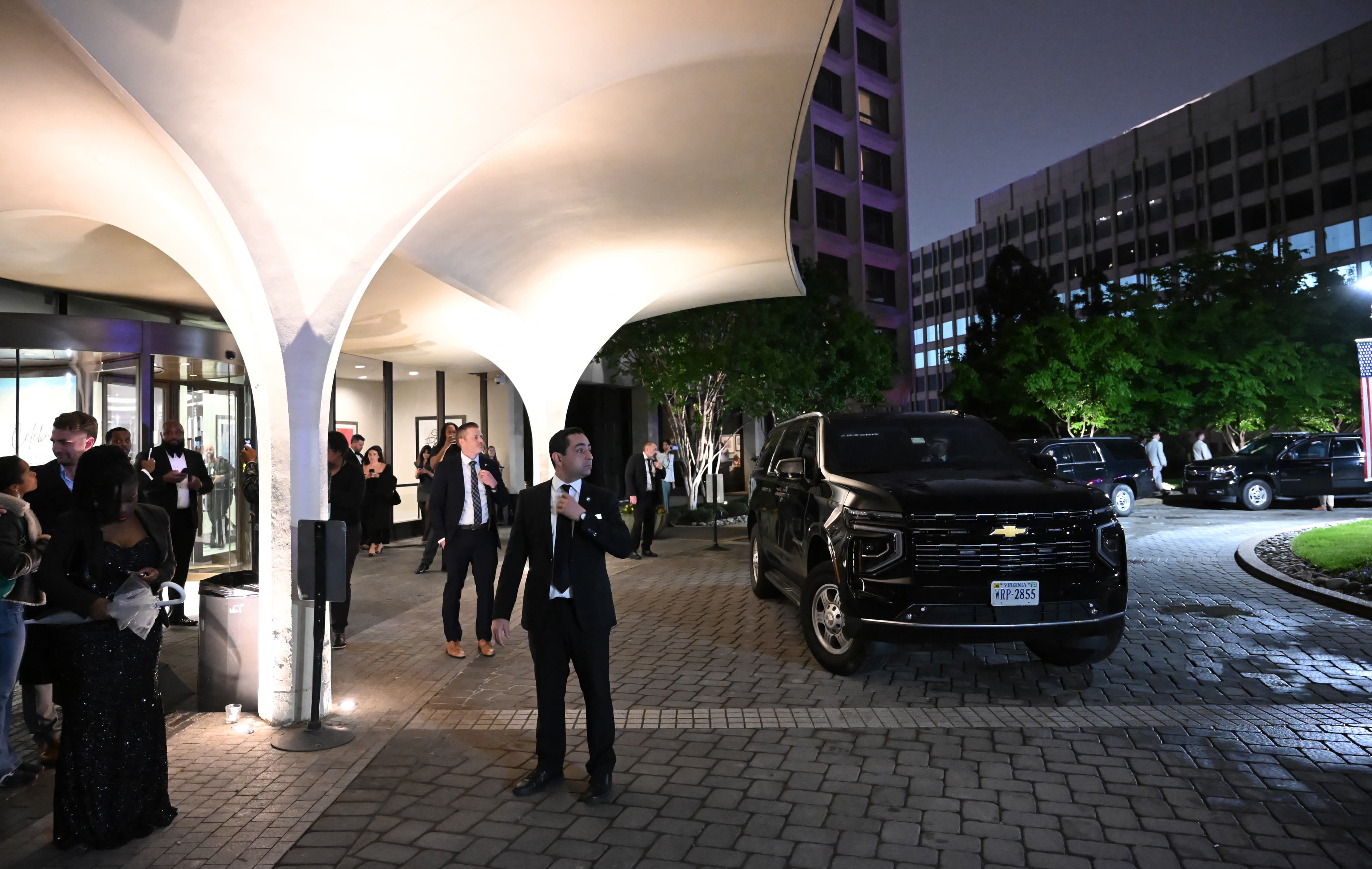"Secret Service officers and guests wait outside the Washington Hilton after a security breach. (Alex WROBLEWSKI / AFP via Getty Images)