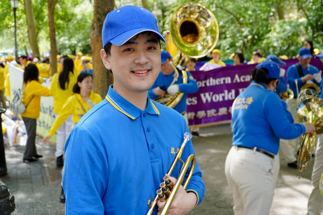 Mark Yang, 27, Yang says his mother practiced Falun Gong even before he was born. He is standing Dag Hammarskjöld Plaza, where practitioners of Falun Gong prepare for a parade celebrating World Falun Dafa Day, May 13, 2026. (Nicholas Zifcak/The Epoch Times)