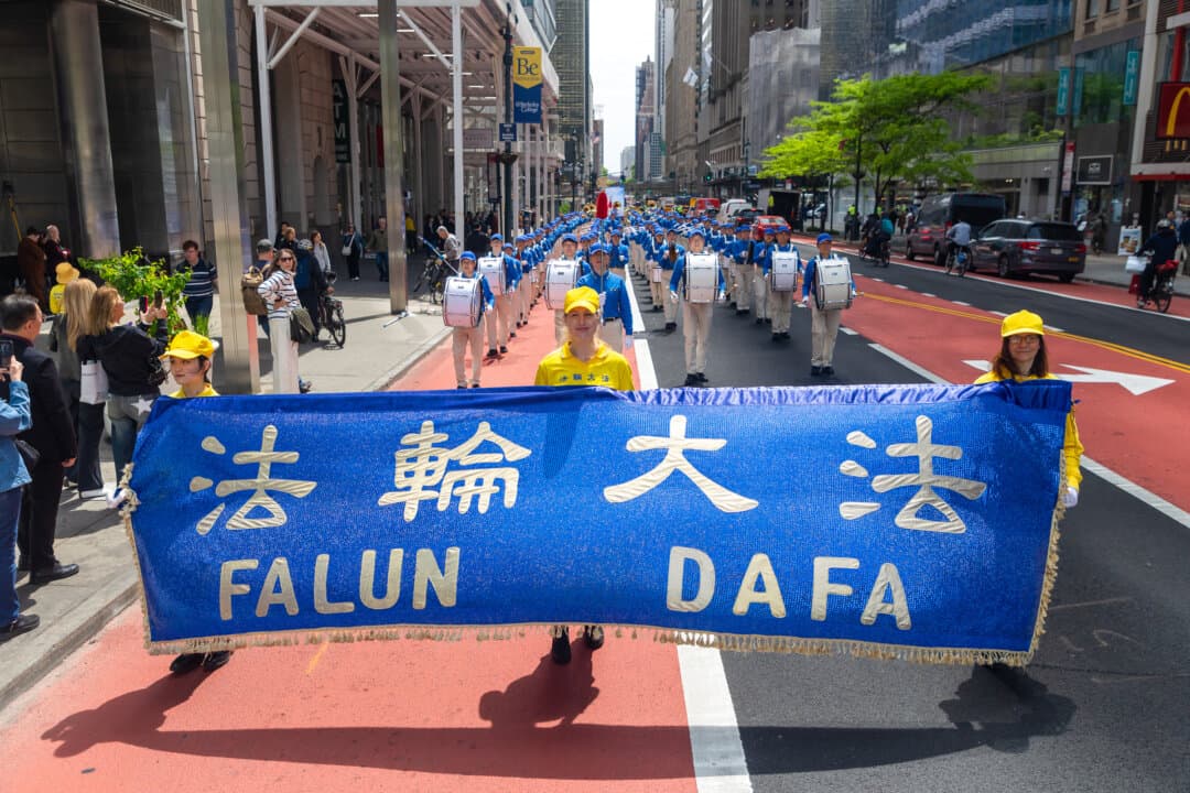 Falun Gong practitioners take part in a parade to celebrate World Falun Dafa Day and call for an end to persecution in China, in New York City, on May 13, 2026. (Mark Zou/The Epoch Times)