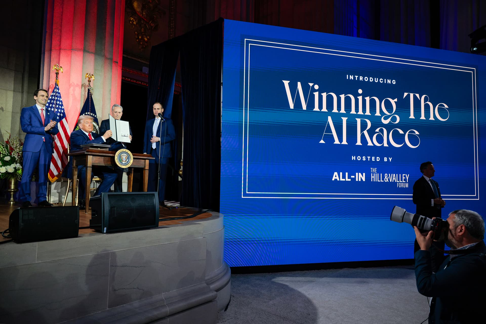 President Donald Trump displays a signed executive order during the “Winning the AI Race” summit in Washington on July 23, 2025. (Chip Somodevilla/Getty Images)